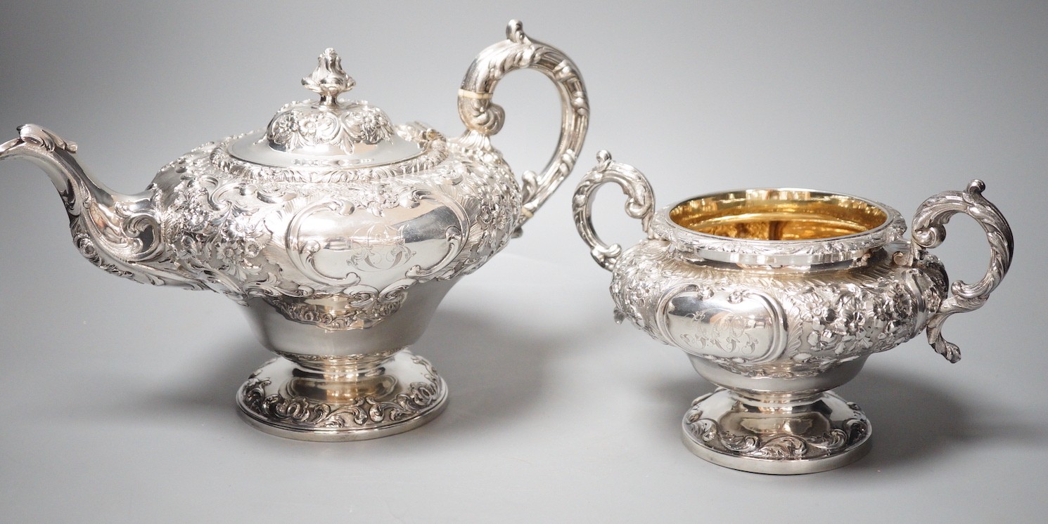 A matched Victorian embossed silver inverted pear shaped three piece tea set, teapot James Mackay, Edinburgh, 1839, cream & sugar, Charles Fox, London, 1838